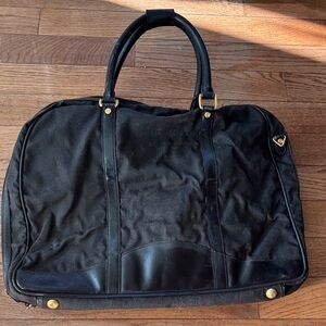 Elegant Black Men's Gucci Travel Bag with suit bag included